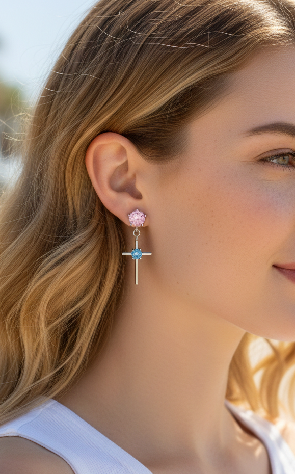 Woman wearing earrings with a blurred outdoor background