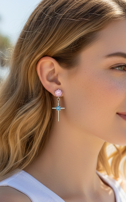 Woman wearing earrings with a blurred outdoor background